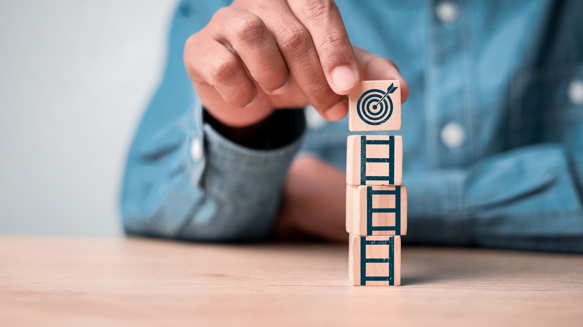 Dartboard with arrow on the top of ladders step for target and goal concept.
